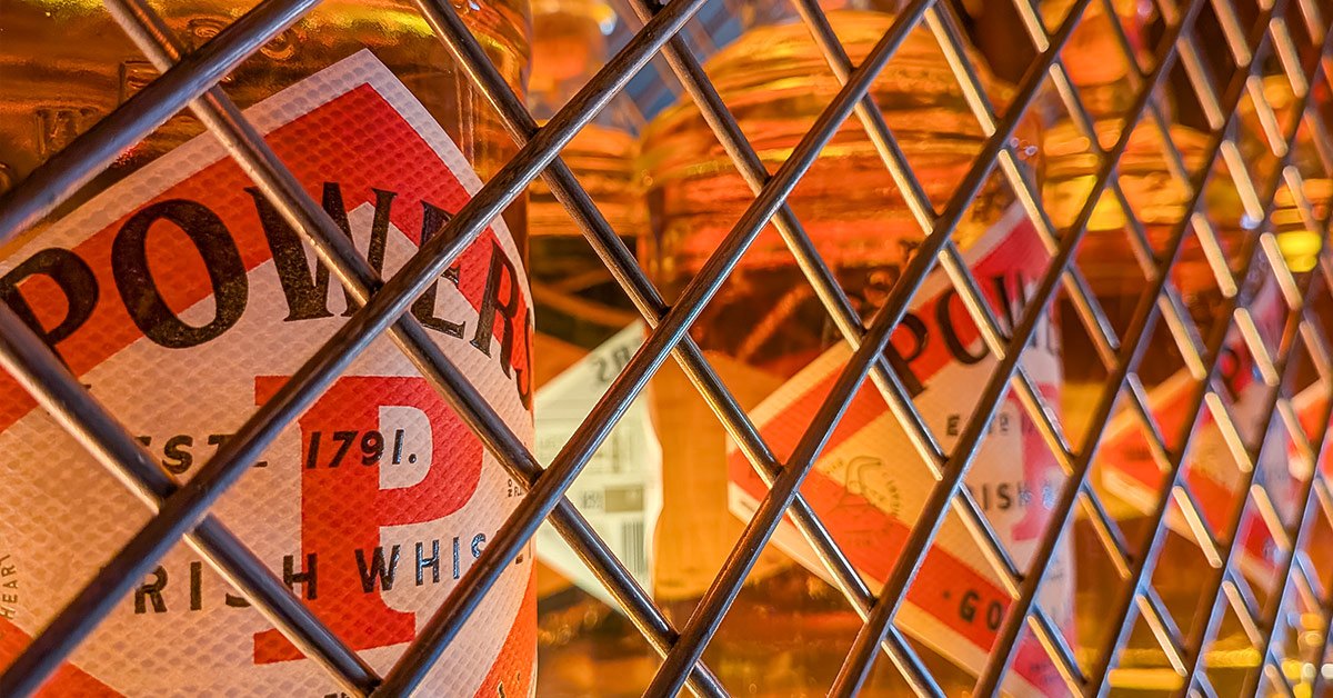 Diamond lattice cabinet doors and a vintage Powers whiskey sign